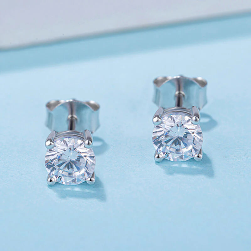 Belamol® Solitaire Round Moissanite Four Prong Earrings